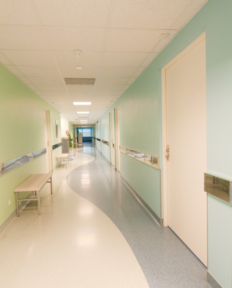 Long corridor in hospital with doors